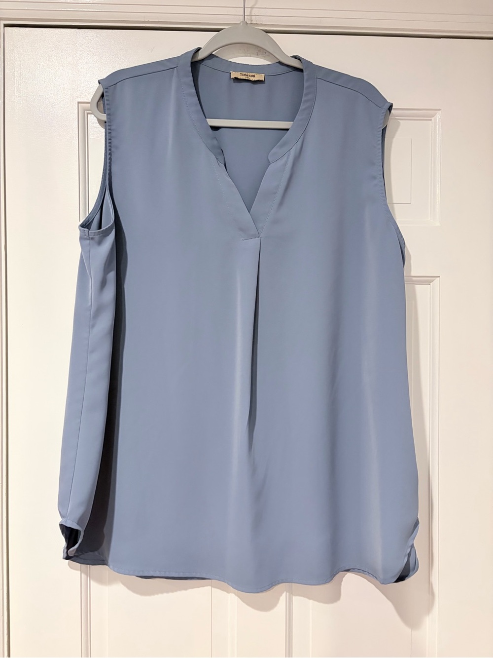 Sleeveless Light Blue V-Neck Blouse by (no brand)
